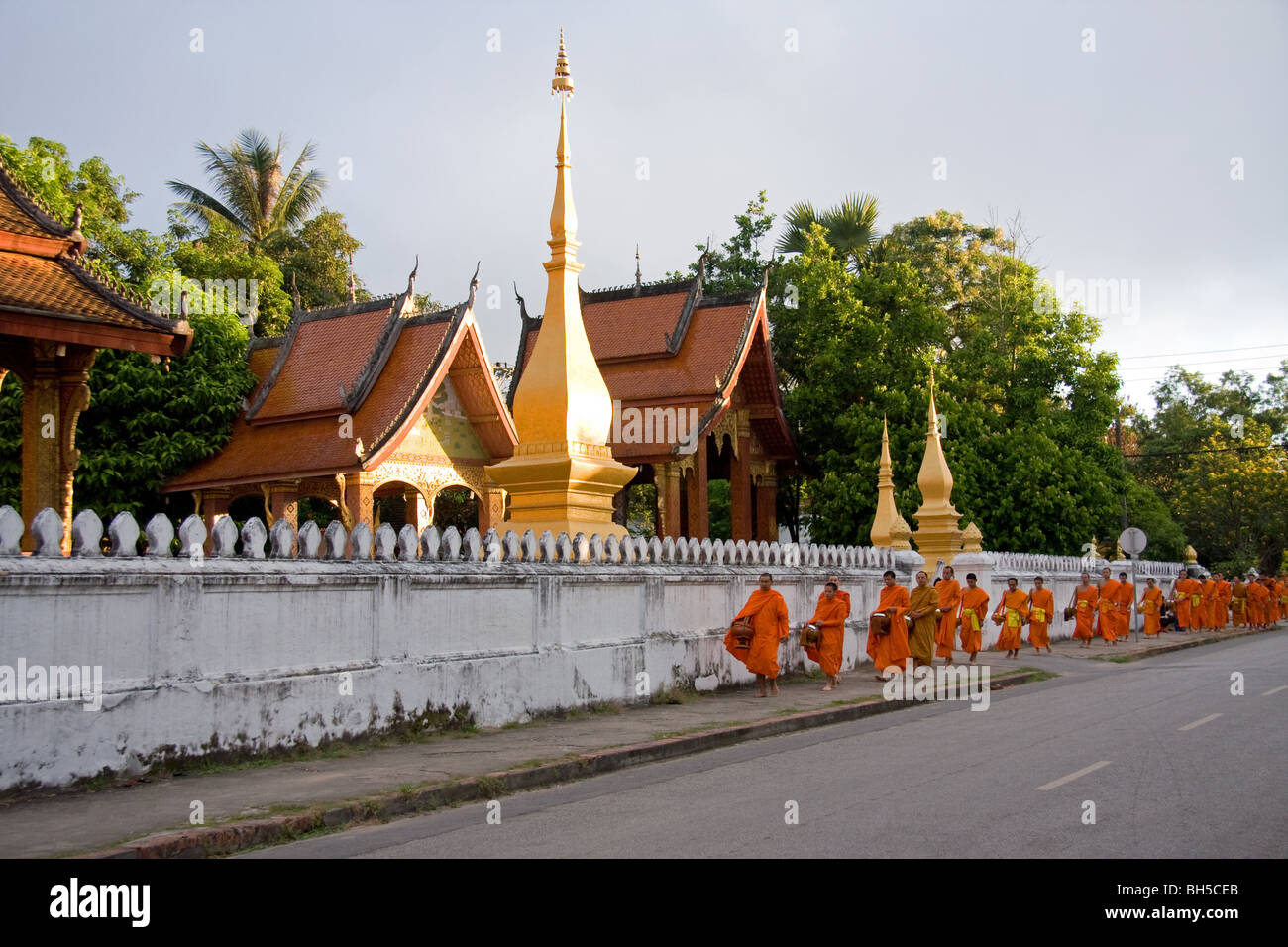Buddhist monks collecting offerings of Alms, Luang Prabang Stock Photo