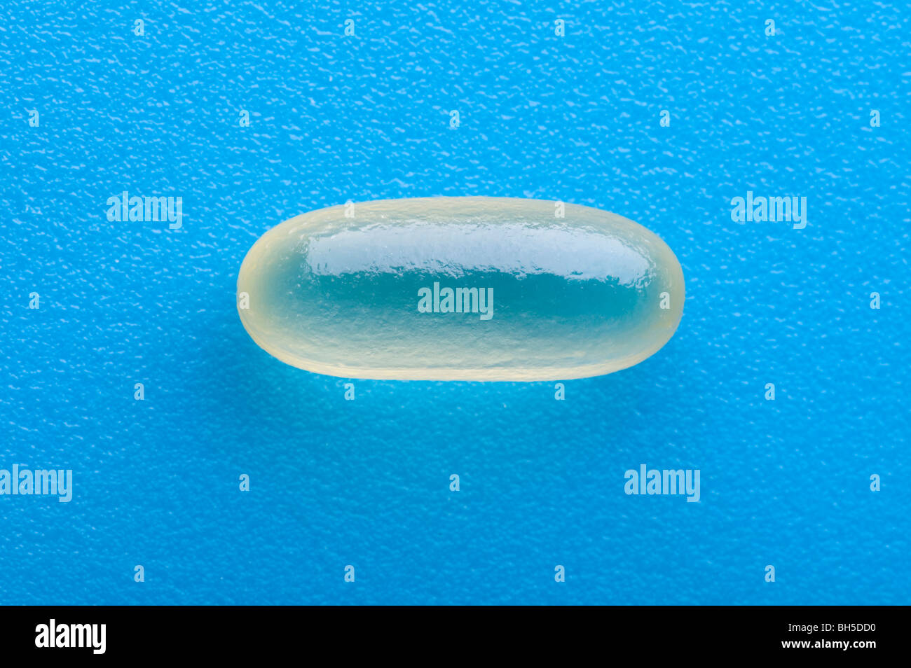 object on blue - Medical Tablets close up Stock Photo - Alamy