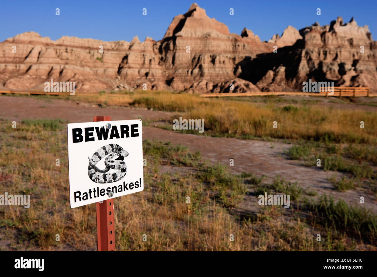 Beware of rattlesnakes warning notice Badlands National Park, South Dakota, United States Stock Photo