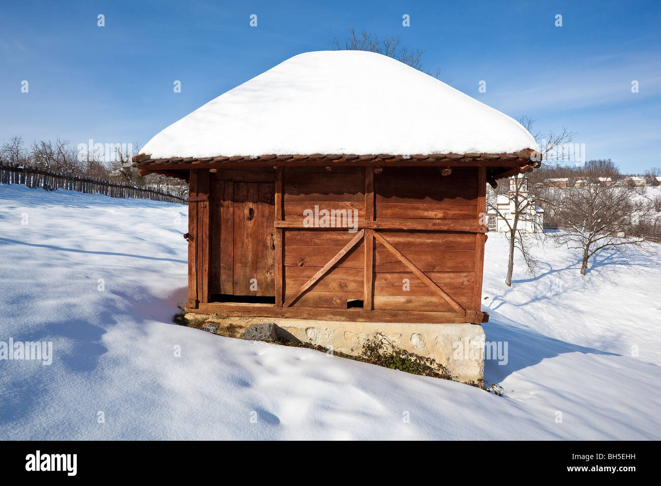 Village Lelic, traditional Serbian economic building "vajat", house, architecture in West Serbia, winter, snow Stock Photo