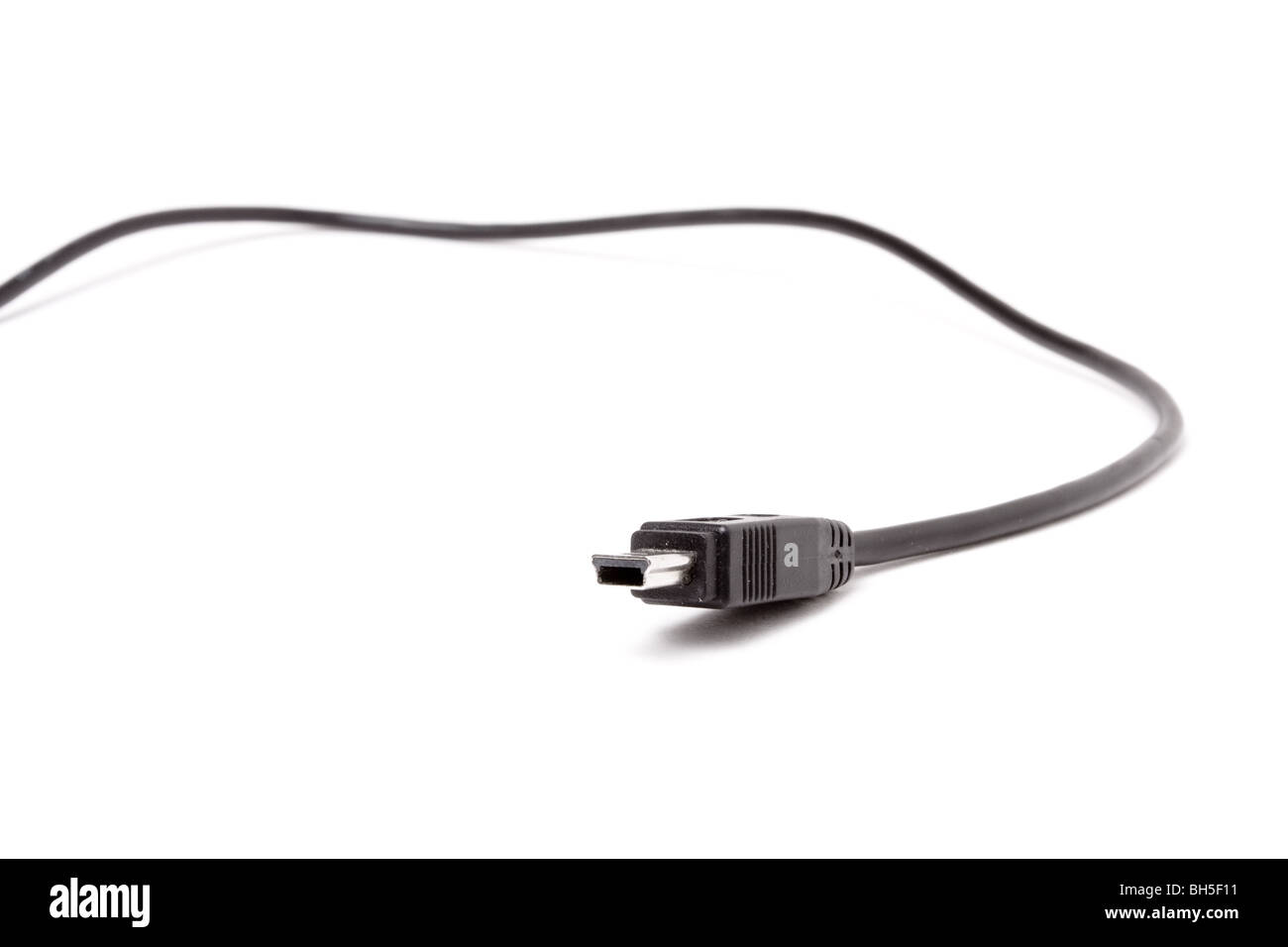 Black Mini USB Cable close up isolated against white background. Stock Photo