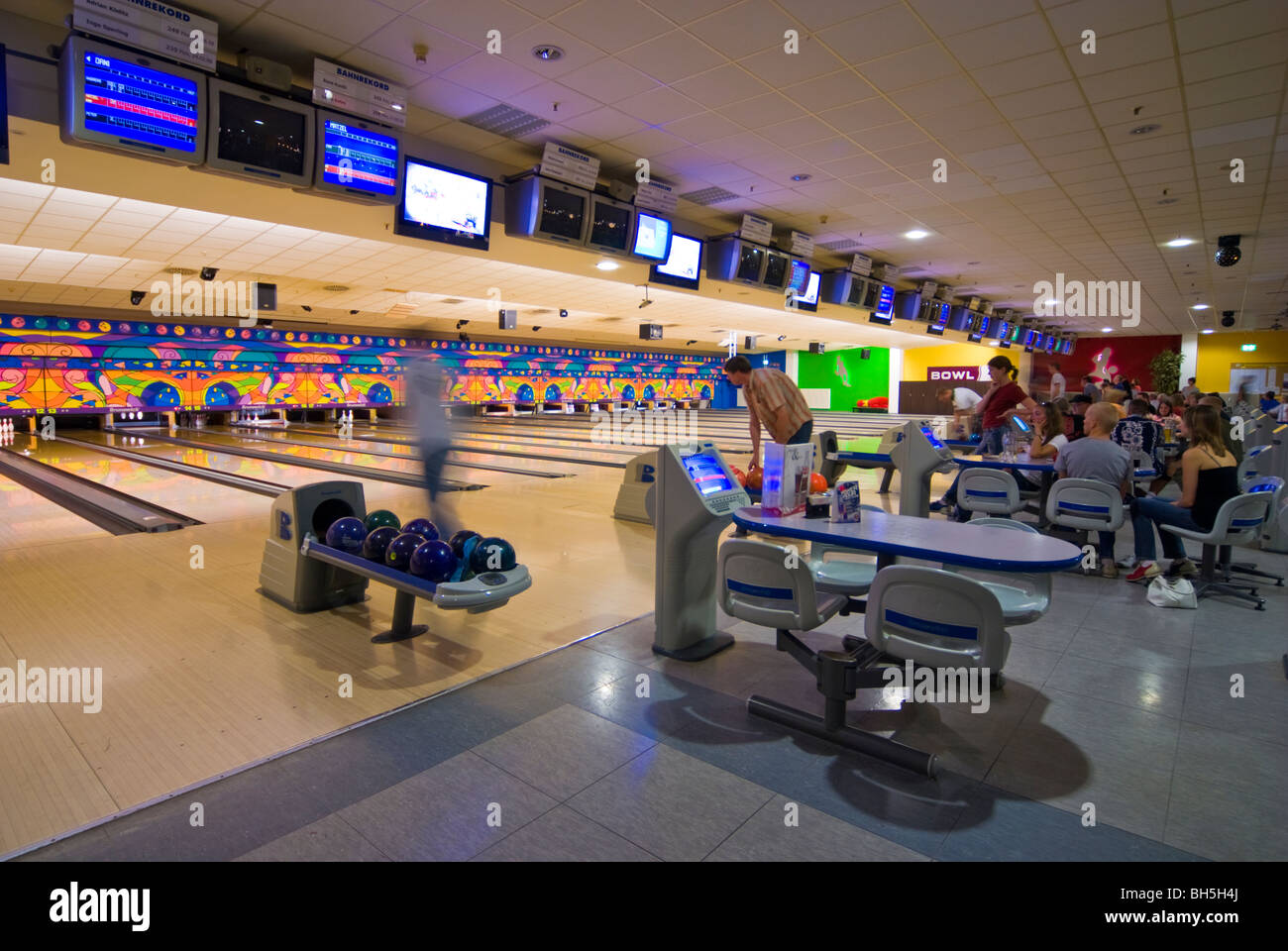 Bowling alleys with people playing bowling in a Bowling Center near  Leipzig, Germany Stock Photo - Alamy