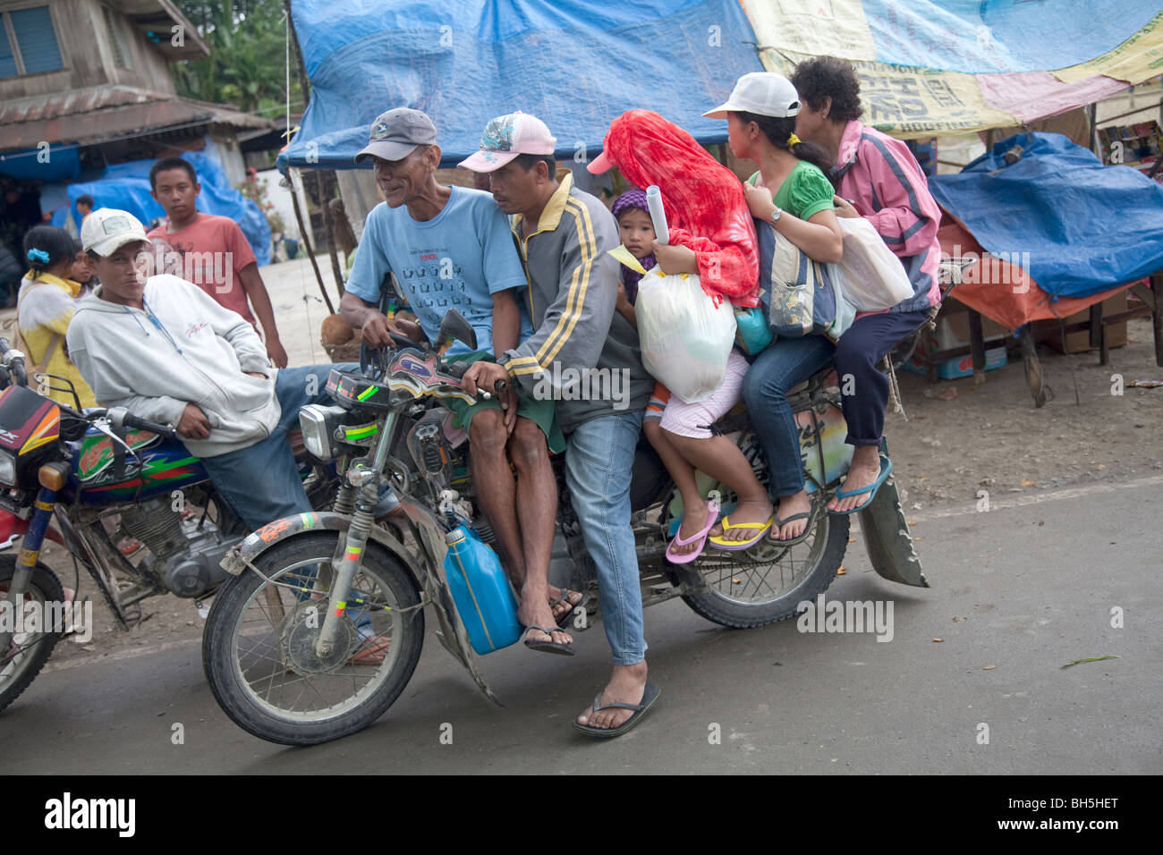 Filipino family on motorbike known as a Habal Habal Stock Photo