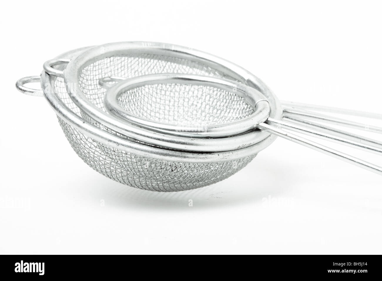 Sieve Abstract of nested sieves isolated against white background. Stock Photo