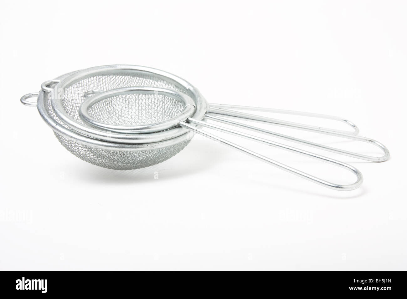 Sieve Abstract of nested sieves isolated against white background. Stock Photo