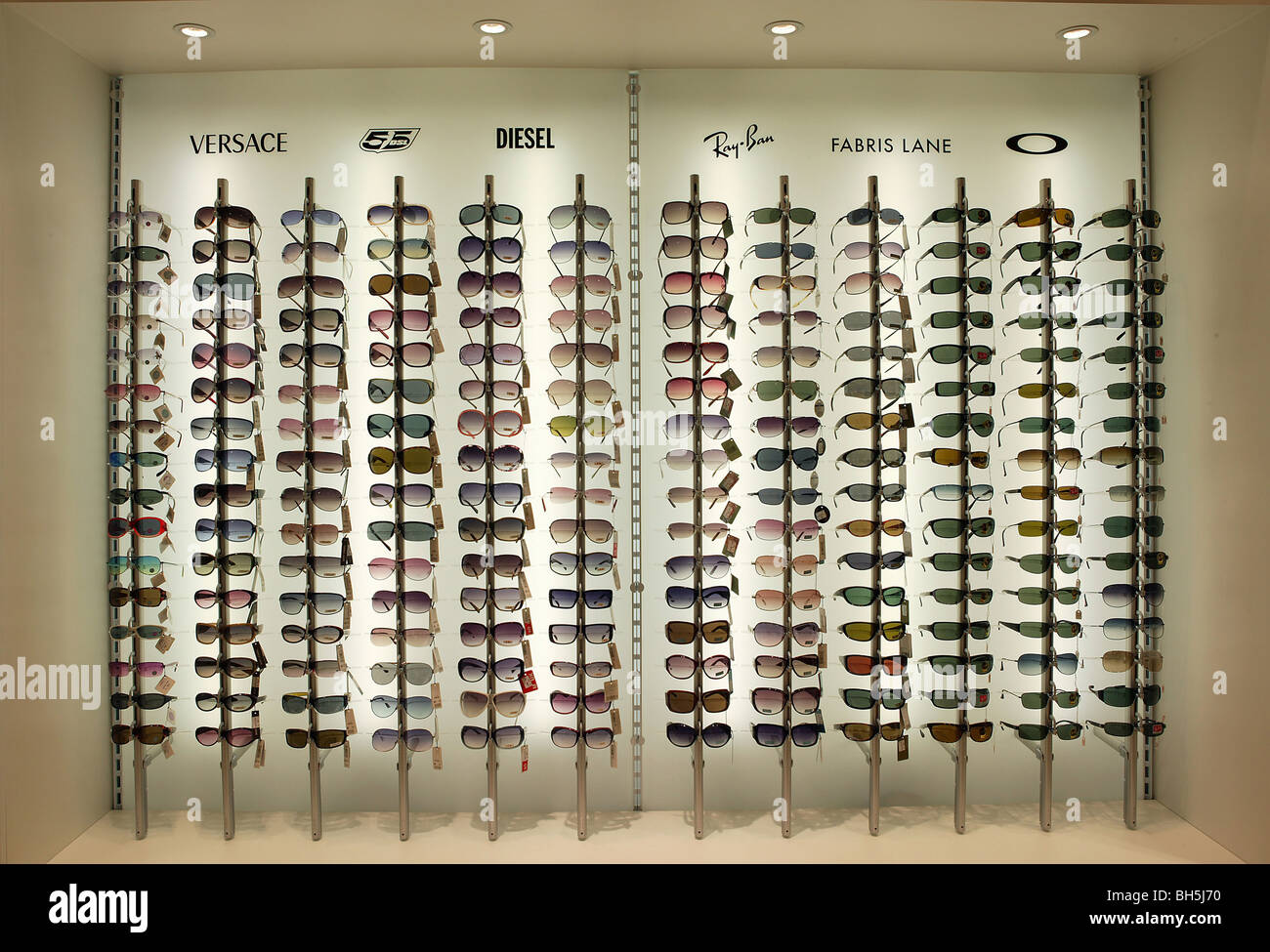 A Display Stand Of Sunglasses Illustrating Fashion And - 