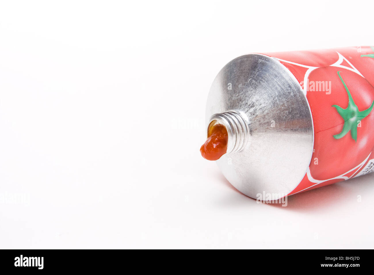 Tomato Puree Tube from low viewpoint isolated against white background