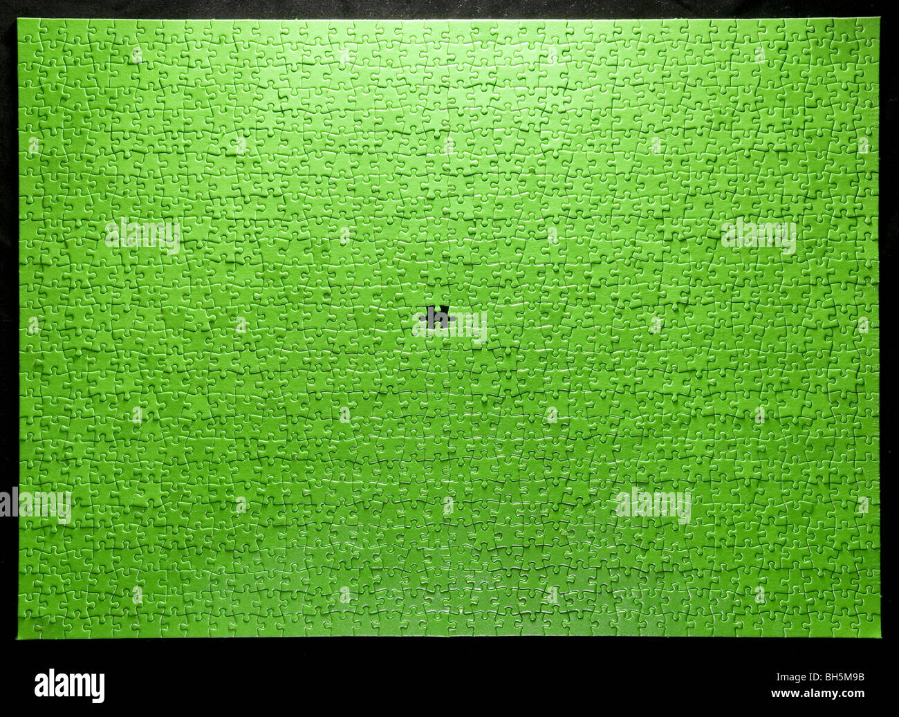 Green Jigsaw On Black Background Stock Photo