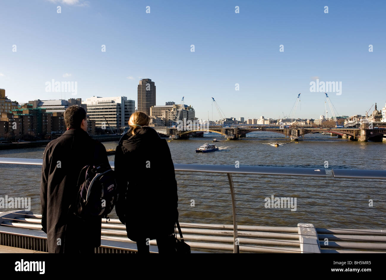 People standing on a bridge hi-res stock photography and images - Alamy