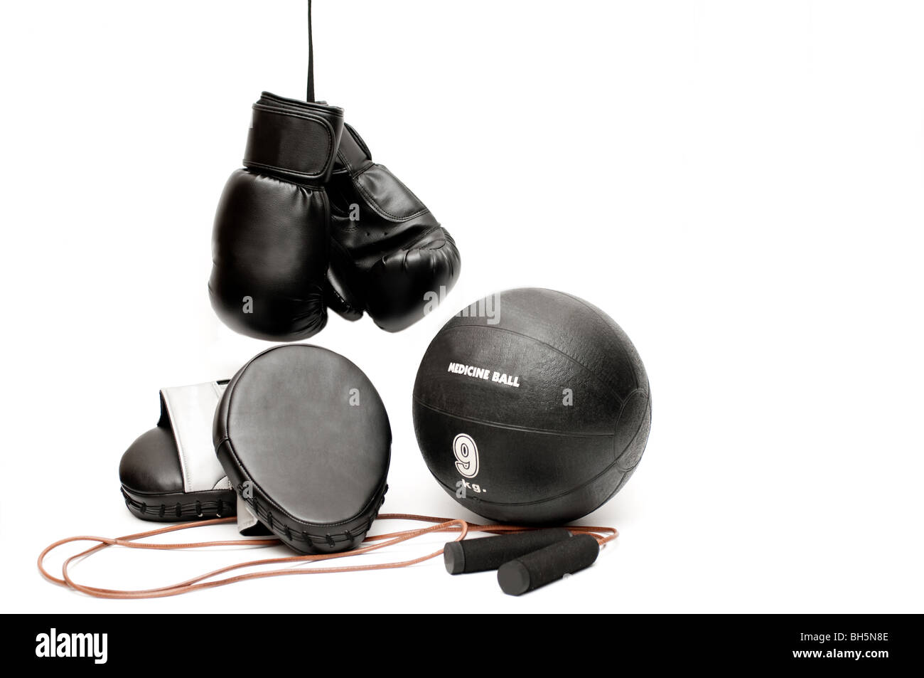 Boxing gloves, pads, jump rope and a medicine ball Stock Photo Alamy