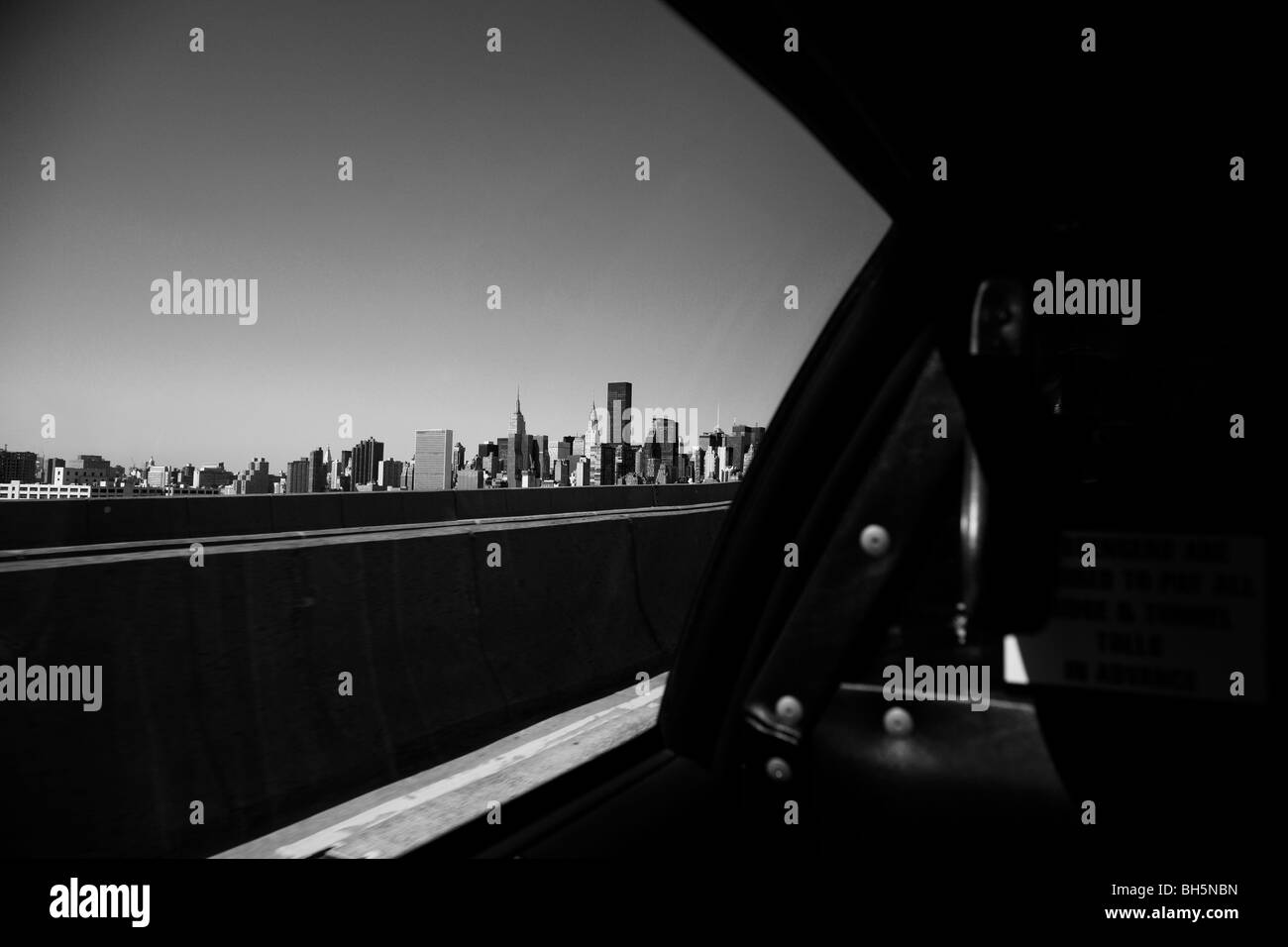 The Manhattan skyline from inside a NYC taxi cab approaching Queensboro Bridge, New York City, New York USA Stock Photo