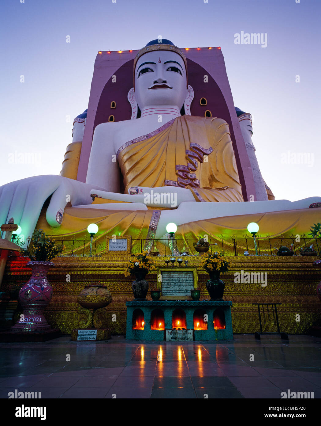 Kyaik Pun Paya Colourful Four Seated Buddhas in twilight Myanmar Burma Stock Photo