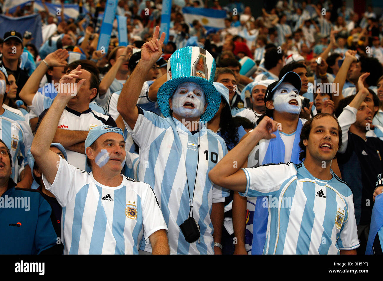 Argentinian football fans sing in the stands at the 2006 Football World Cup Finals Stock Photo