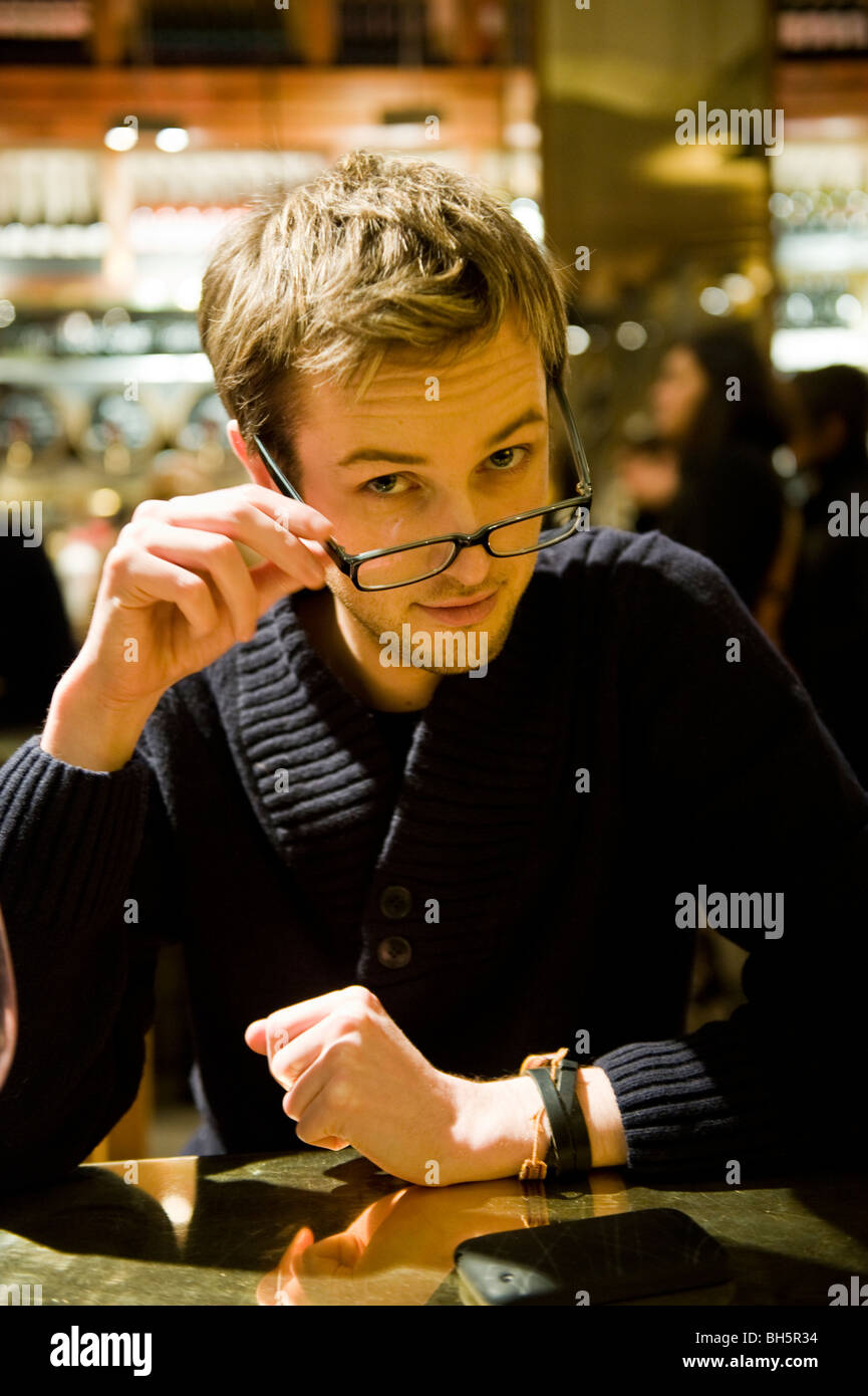 A young man wearing glasses Stock Photo - Alamy