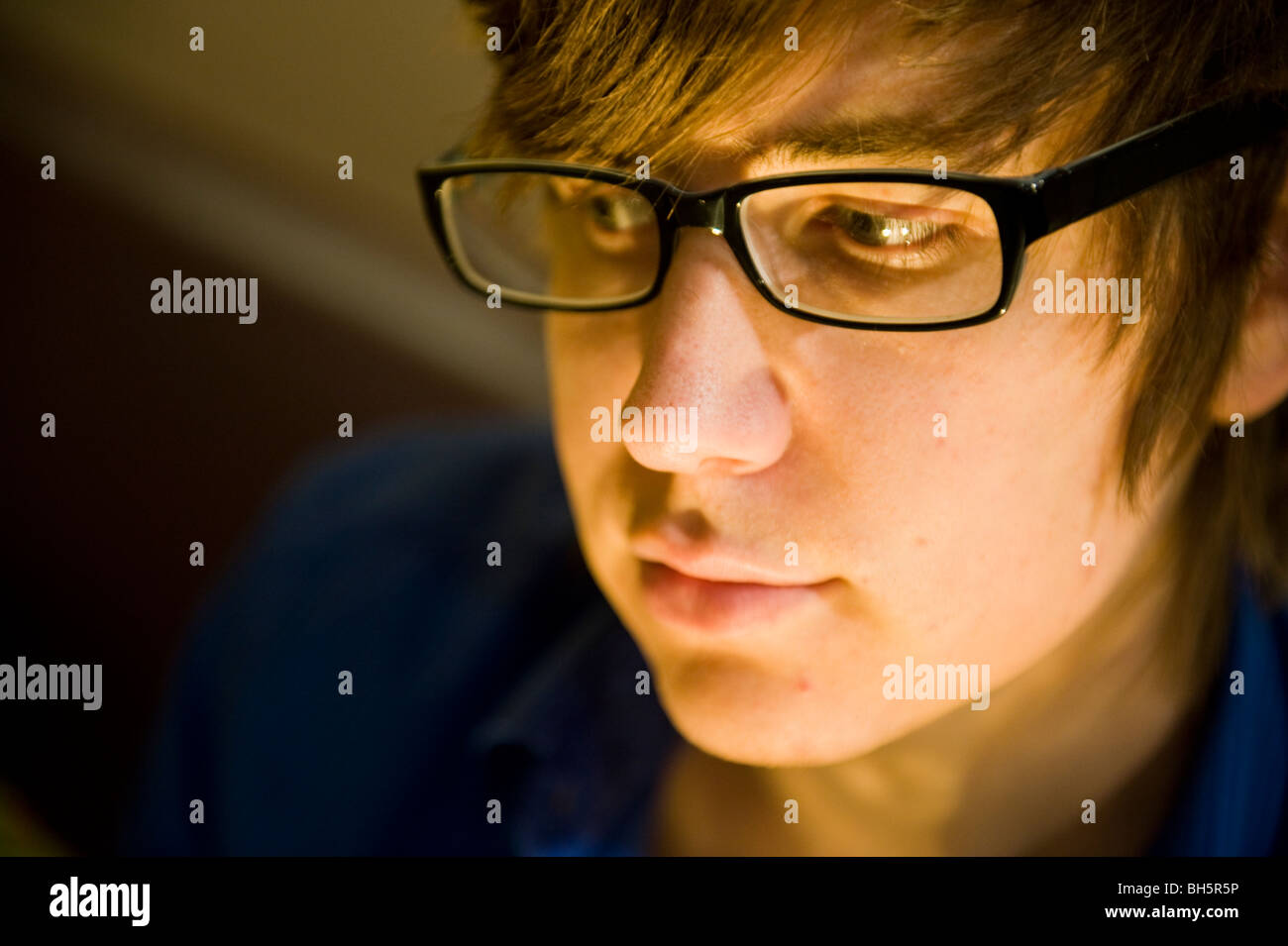 A young man wearing glasses Stock Photo - Alamy