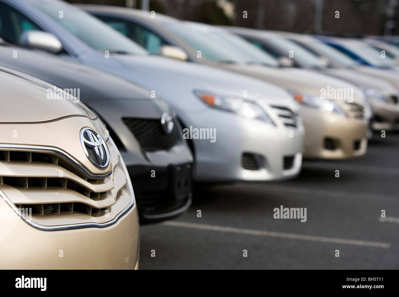 Toyota vehicles on a dealership lot.  Stock Photo