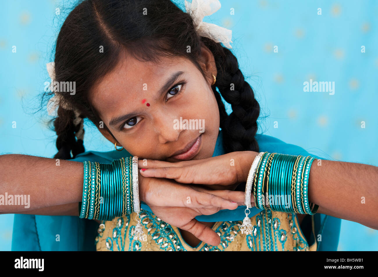 Pretty young indian girl wearing turquoise bangles. Andhra Pradesh. India Stock Photo
