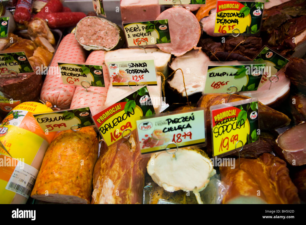 Polish sausages and cooked meat / meats in a chiller in