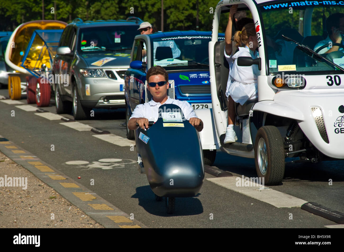 Man participating in 2006 Michelin Challenge Bibendum, driving an alternative vehicle in Paris traffic Stock Photo