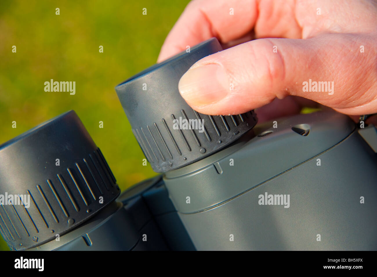 Adjustment of focus on binoculars Stock Photo Alamy