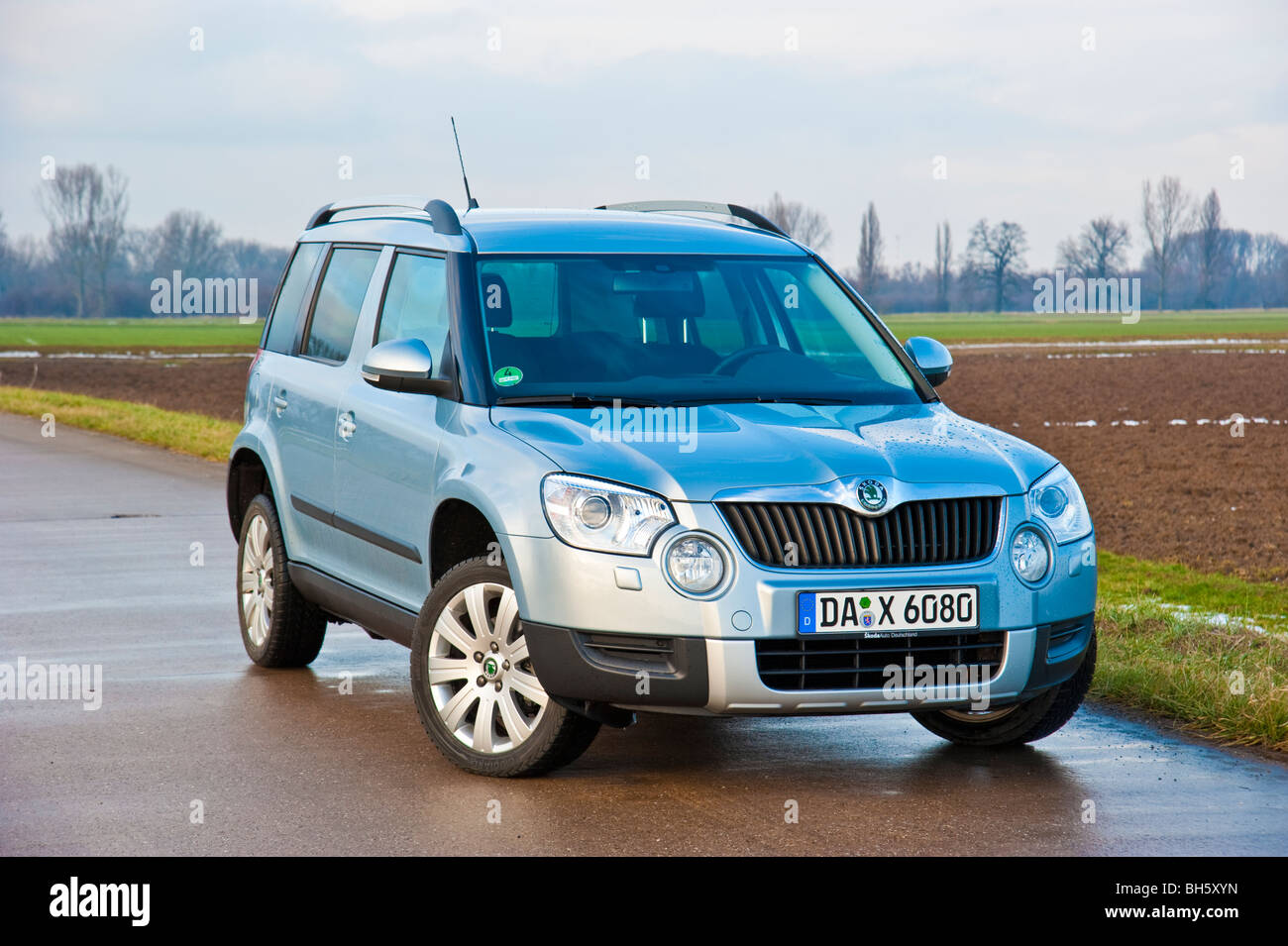 Front, side view Skoda Yeti SUV, 2010 model in light blue metallic parked  on a street next to a field Stock Photo - Alamy