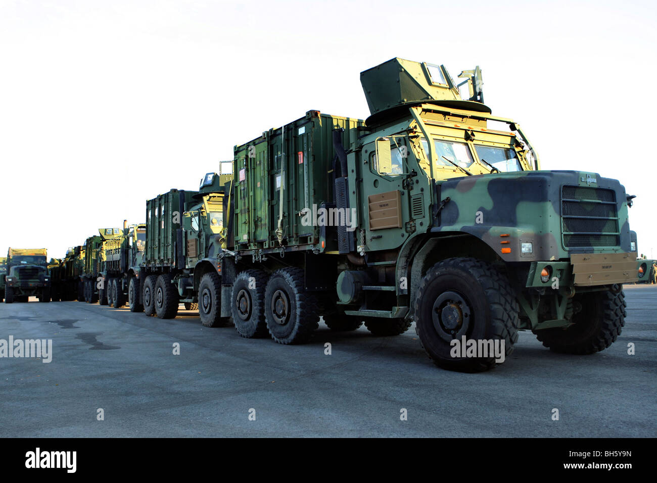 Armored trucks sit on the pier at Morehead City, North Carolina, awaiting deployment. Stock Photo
