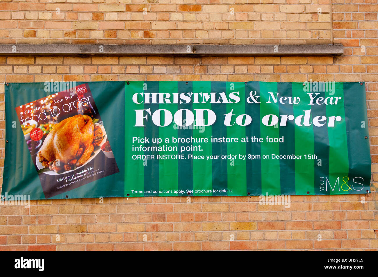 The Marks & Spencer shop store advertising Christmas food to order in Norwich , Norfolk , England , Britain , Uk Stock Photo