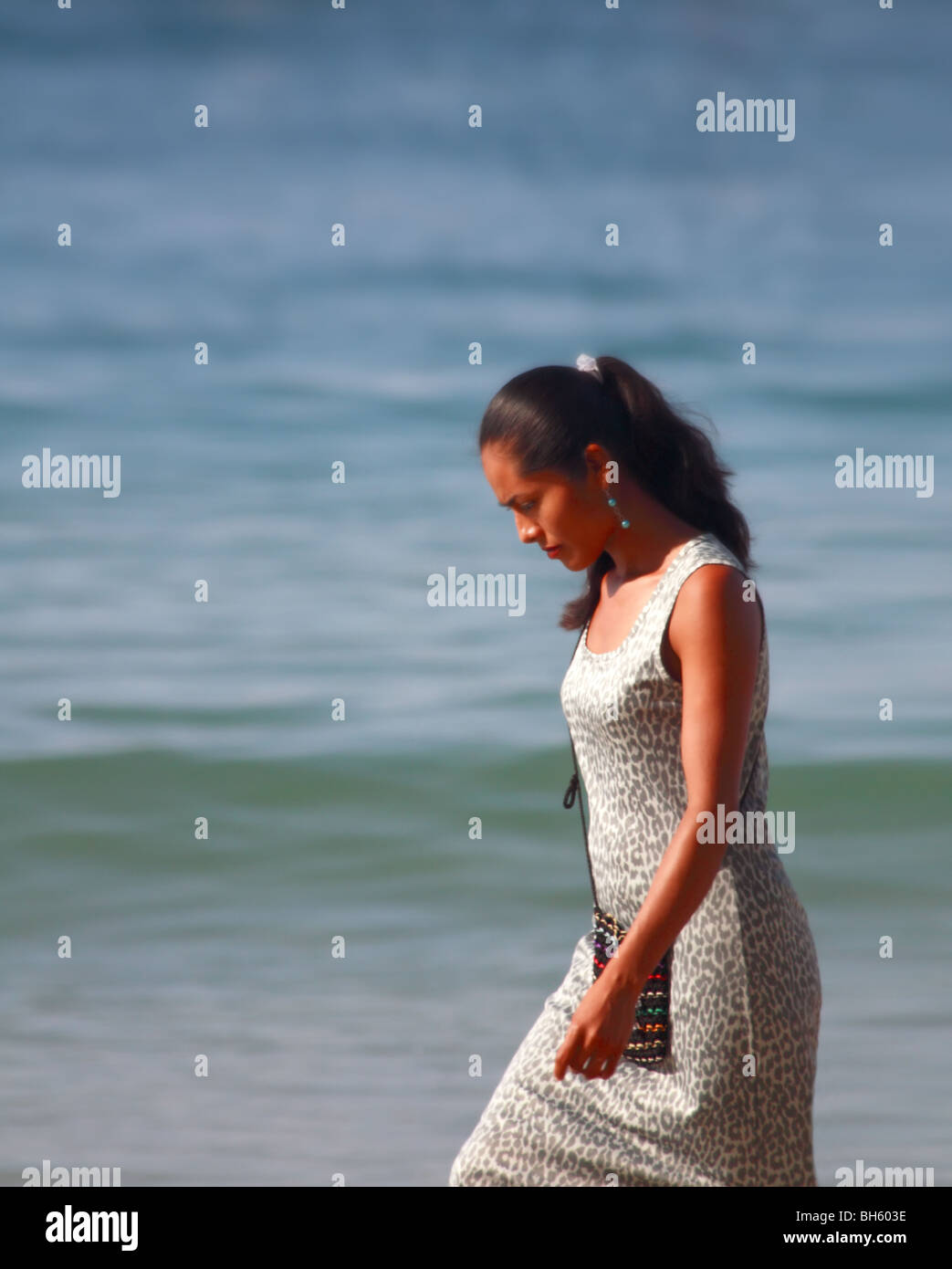 Beautiful Mexican Girl strolling on Puerto Escondido Beach Oaxaca Mexico Stock Photo