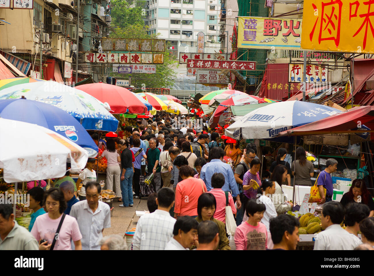 Asia China Hong Kong Shoppers Buy Produce At The Shau Kai Wan District Street Market Stock