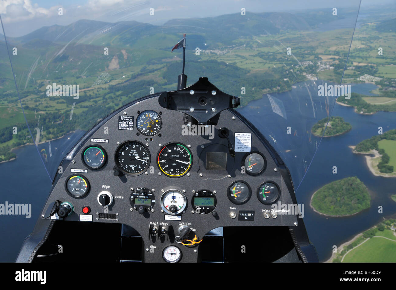 Cockpit of autogyro being flown over Derwent water in the Lake District Stock Photo