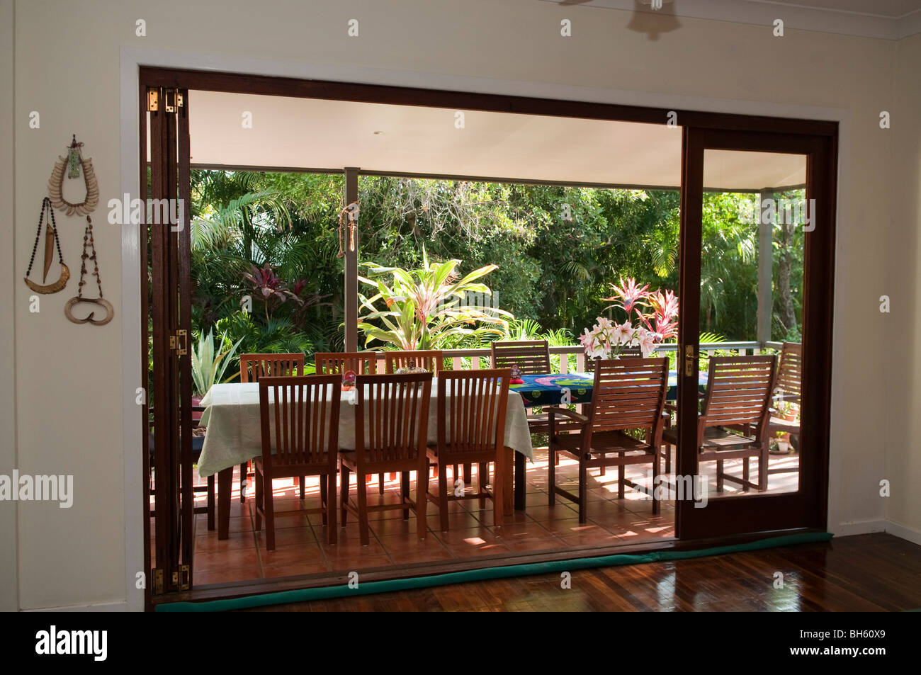Looking From Inside Out To The Verandah And Garden Of A Private