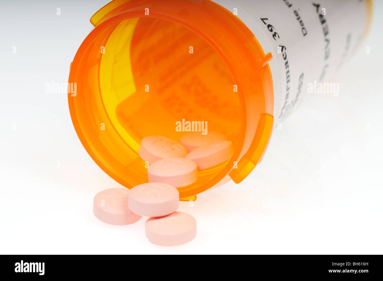 Prescription bottle of the anti-platelet medication plavix on side with plavix pills that is used to  treat P.A.D. Stock Photo