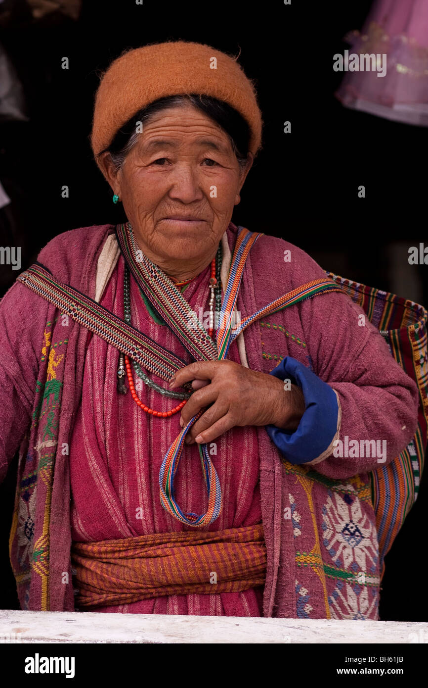 Woman in traditional dress, market Tawang Stock Photo