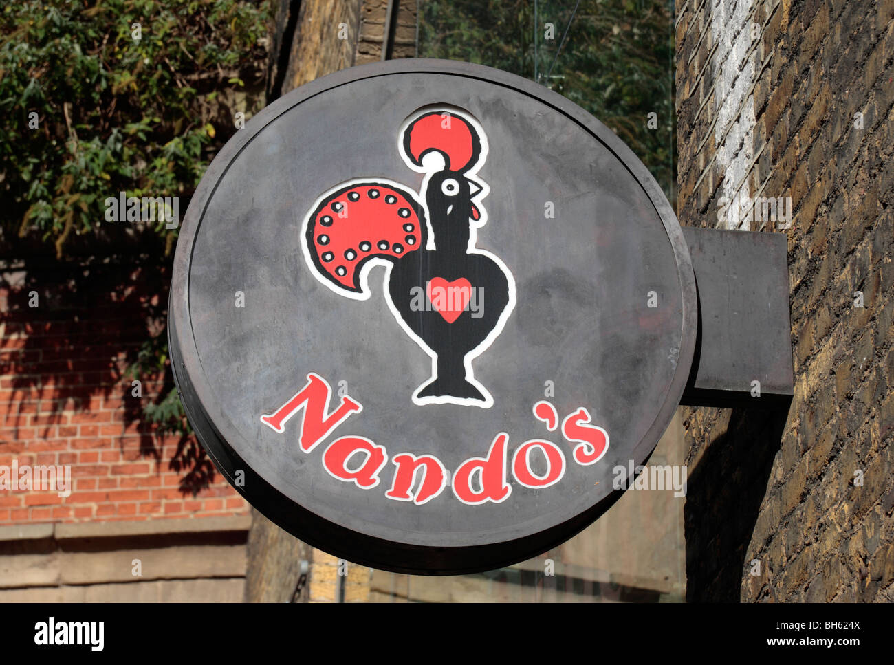 Nando's sign and logo above the restaurant in Clink Street, London, England.  Oct 09 Stock Photo
