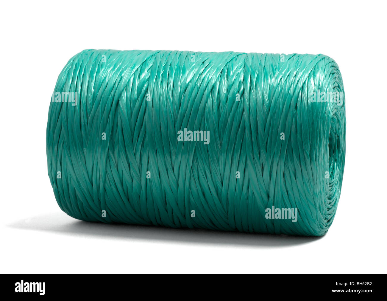 Roll of green twine on white background Stock Photo