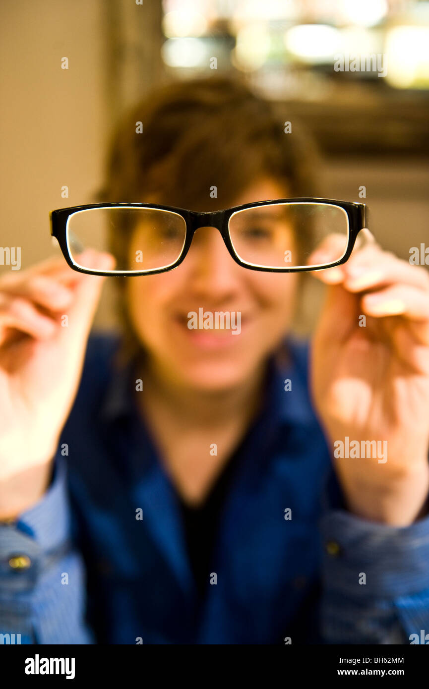 A young man wearing glasses Stock Photo - Alamy