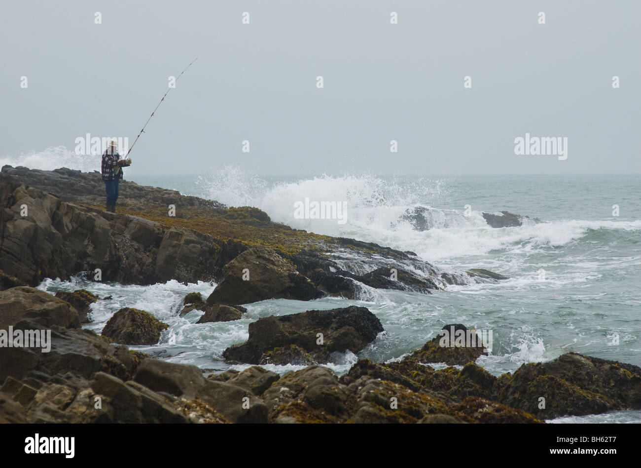 Lone fisherman at Pescadero Beach, California, USA Stock Photo