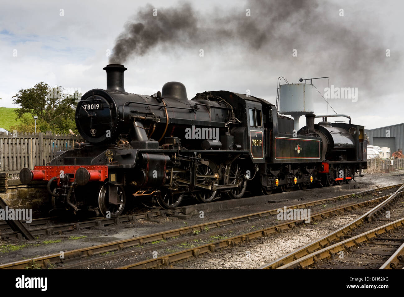 Class 2 Standard No 78019 Engine & Saddle Tank Engine, Embsay & Bolton Abbey Steam Railway, Yorkshire Dales, England Stock Photo