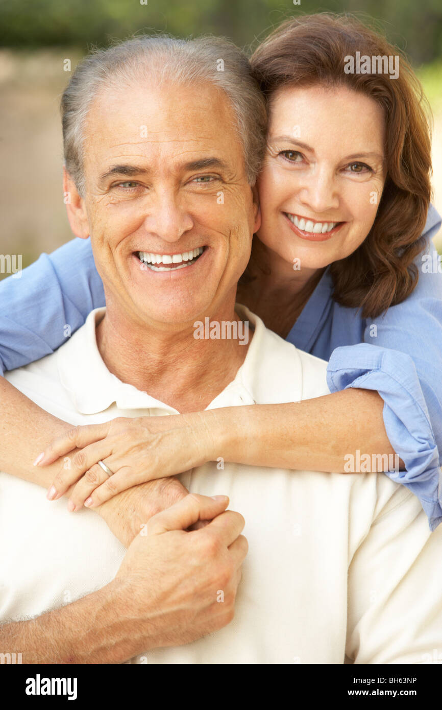 Senior Couple Relaxing In Garden Together Stock Photo - Alamy