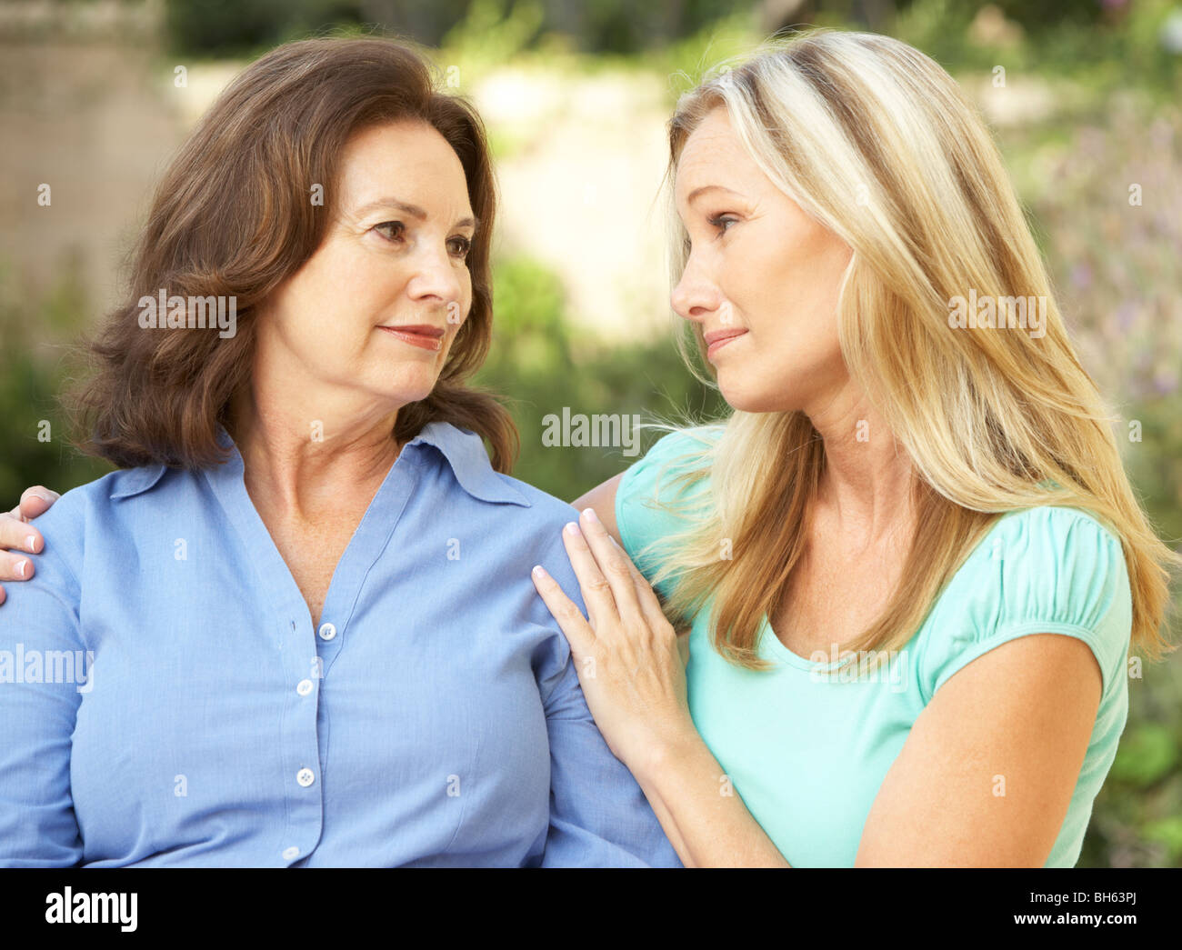 Senior Woman Being Consoled By Adult Daughter Stock Photo - Alamy