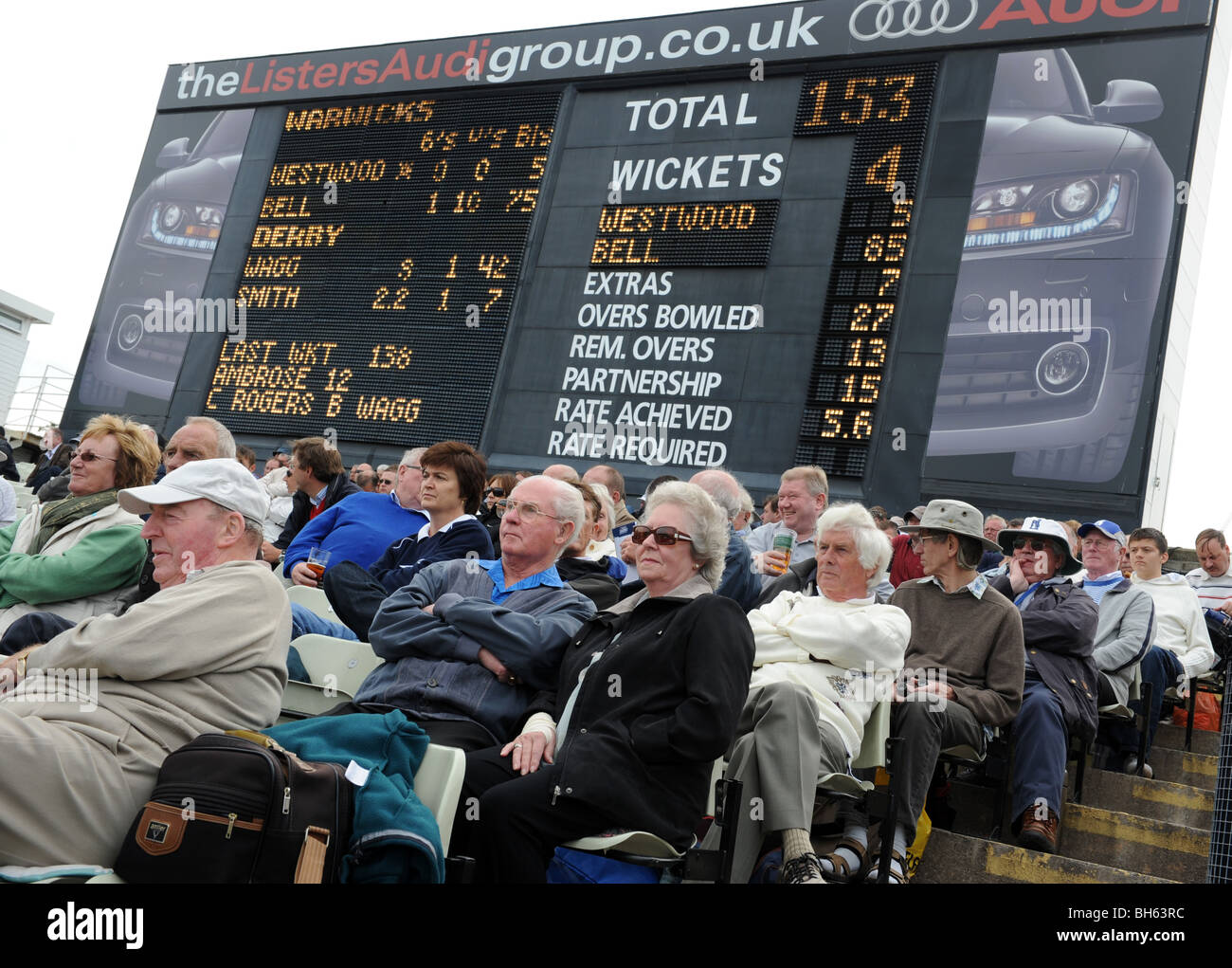 Cricket fans watching Warwickshire County Cricket Clubs last match in front of the old Edgbaston scoreboard 6/9/09 Stock Photo