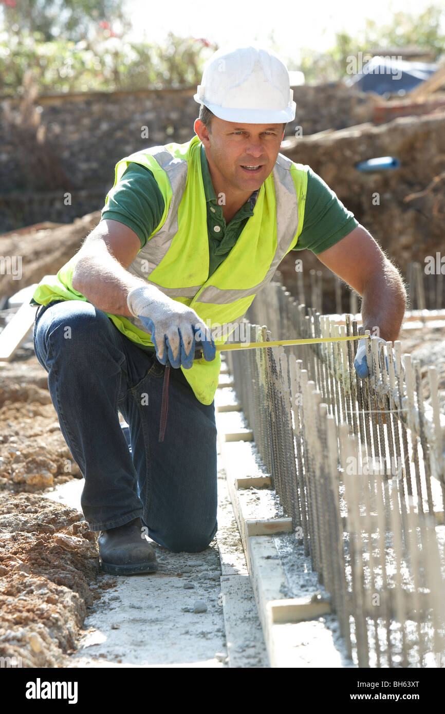 Construction Worker Laying Foundations Stock Photo Alamy