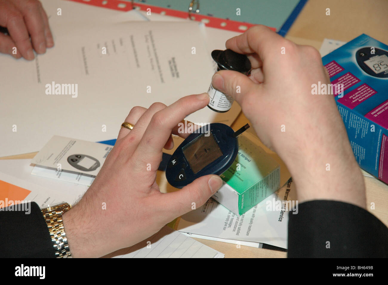 Performing blood test for diabetes Stock Photo Alamy