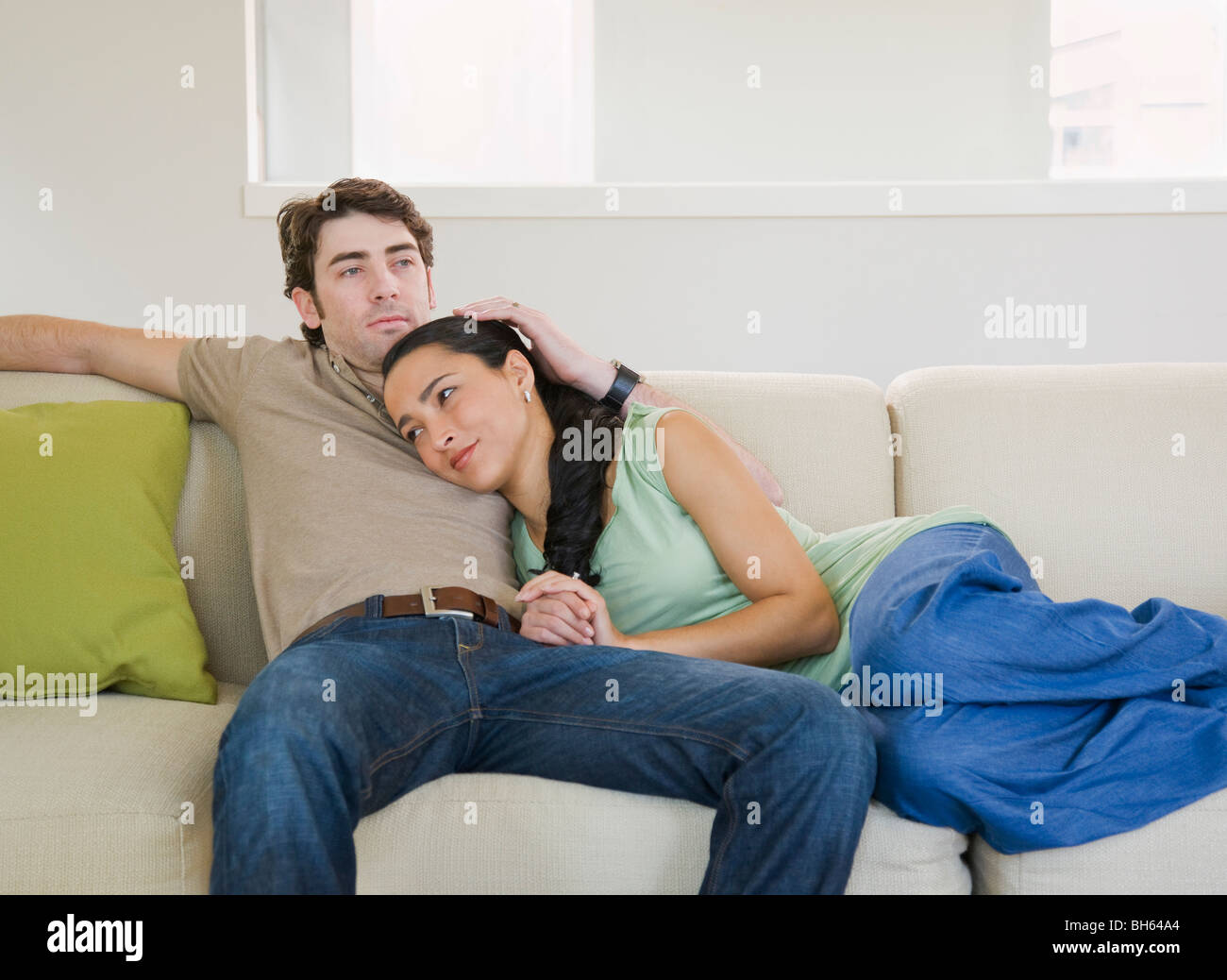 Couple on couch Stock Photo Alamy