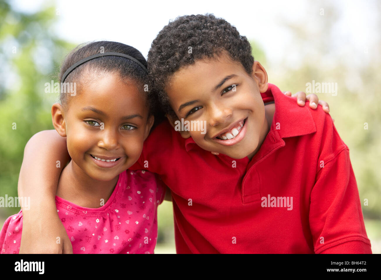 Portrait Of Brother And Sister In Park Stock Photo - Alamy