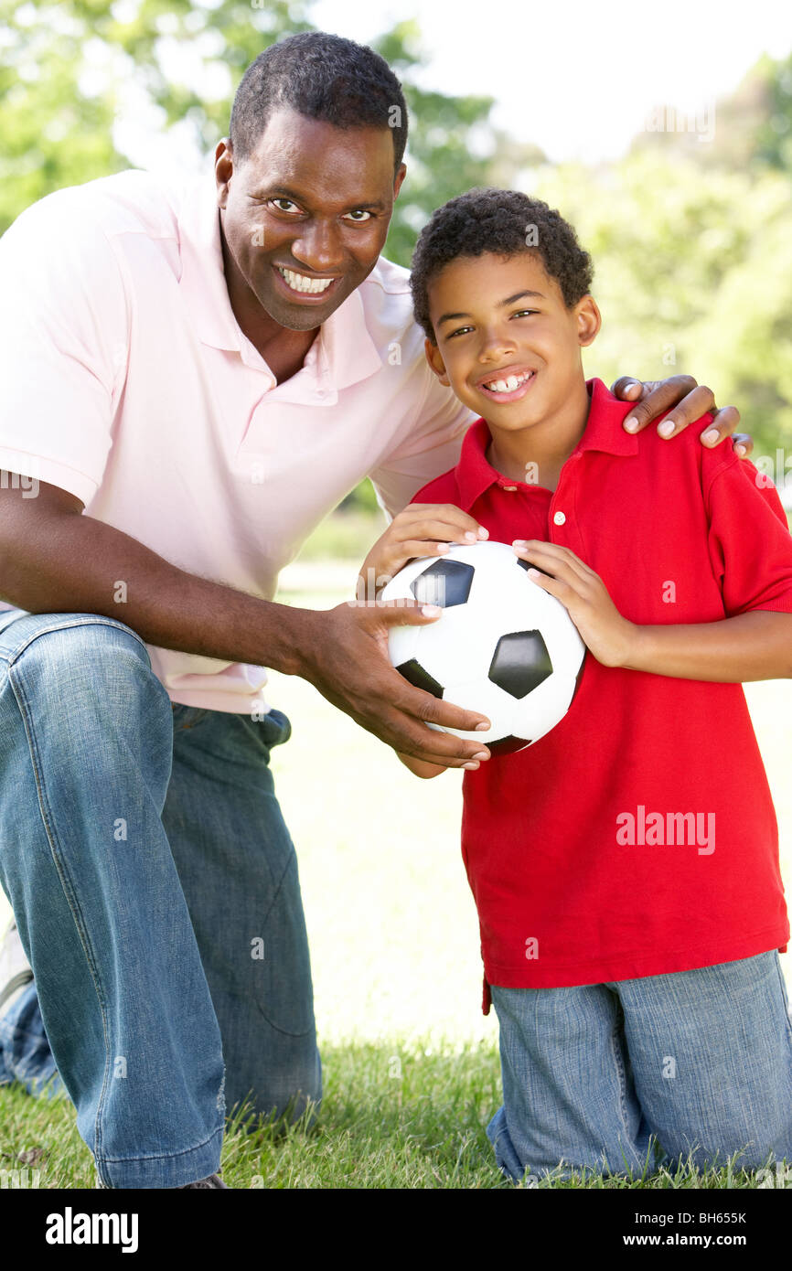 Father And Son In Park With Football Stock Photo - Alamy