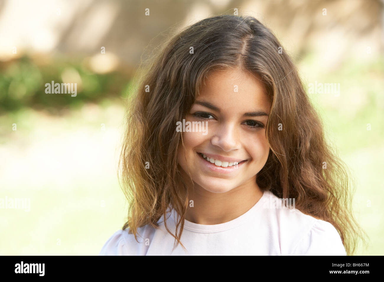 Portrait Of Young Girl In Park Stock Photo - Alamy