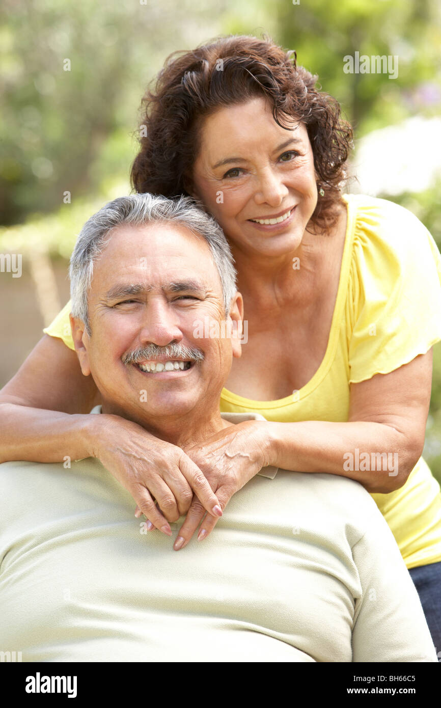 Senior Couple Relaxing In Garden Together Stock Photo - Alamy