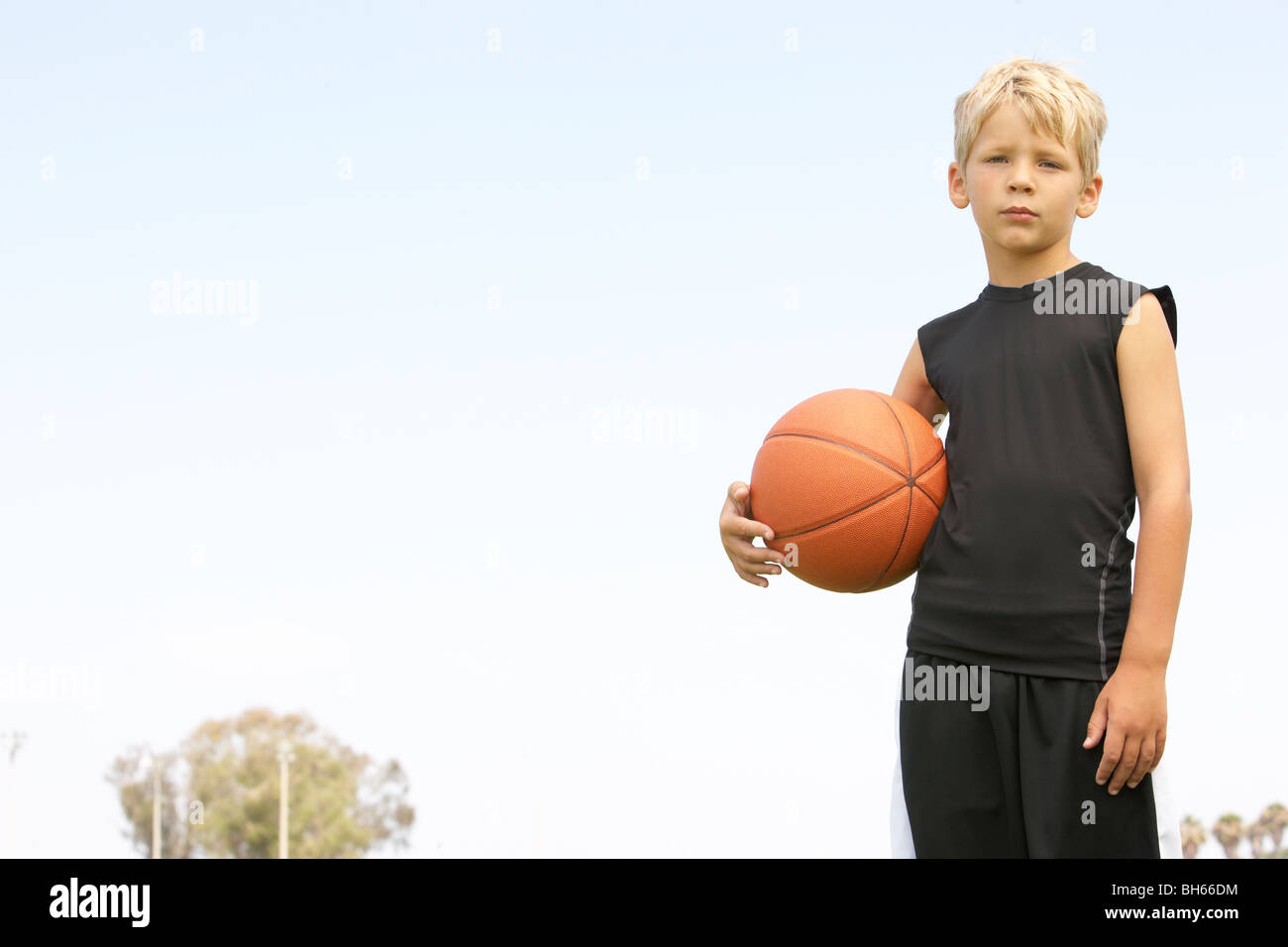 Young Boy Playing Basketball Stock Photo