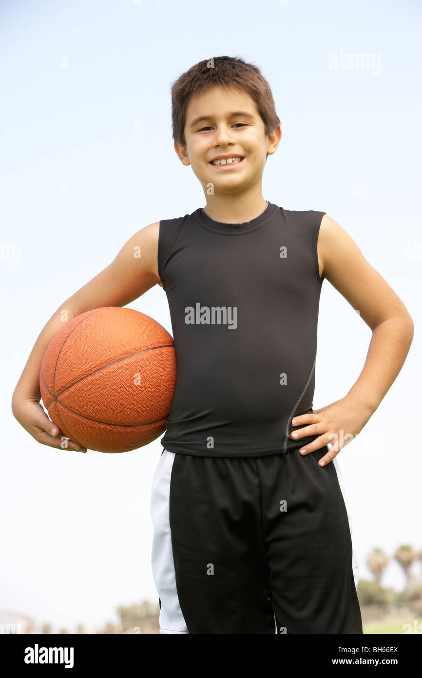 Young Boy Playing Basketball Stock Photo